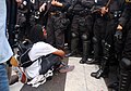 Image 49A "No NATO" protester in Chicago, in front of police, 2012 (from Nonviolent resistance)