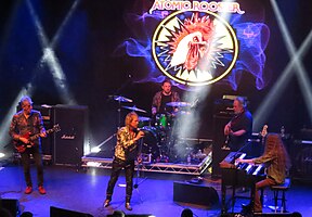 Atomic Rooster performing in 2021, (from left to right) Steve Bolton, Pete French, Paul Everett, Shug Millidge, and Adrian Gautrey