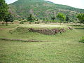 The ruined Bharhut Stupa; seen behind it is the Lal Pahadi (Red Mountain)