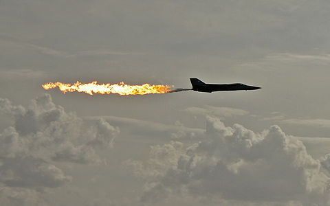 RAAF General Dynamics F-111 Aardvark aircraft performing a dump-and-burn fuel dump at Australian International Airshow, by John O'Neill