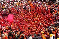 Colour drenched devotees in Radha Krishna Temple, Mathura, India.