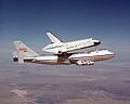 1977 - The Space Shuttle Enterprise test vehicle is carried on its maiden "flight" sitting on top of a Boeing 747.