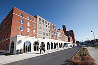 A large multi-story brick building on a university campus.