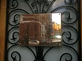 Plaque outside the embassy in Belarusian and English depicting the National emblem of Belarus