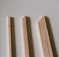 Three different sizes of balsa wood stock.