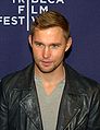 Brian Geraghty interpreta Sean Roman