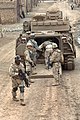 Soldiers load into an M2 Bradley