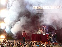 Taking Back Sunday on a smoky stage