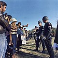 Image 8A demonstrator offers a flower to military police at a National Mobilization Committee to End the War in Vietnam-sponsored protest in Arlington, Virginia, on October 21, 1967. (from Nonviolent resistance)