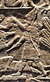 Assyrian warrior holding the head of Elamite King Teumman.[6]
