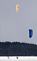 Sailing over snow with a sail or power kite