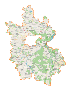 Mapa konturowa powiatu piotrkowskiego, blisko centrum u góry znajduje się punkt z opisem „Jarosty”