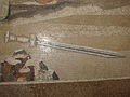 Detail of a fallen sword from the bottom right of the Mosaic.