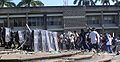 Police officers with riot shields being attacked