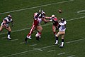 Rams QB Marc Bulger attempts a pass behind Brandon Moore (linebacker)