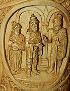 Suddhodhana and Maya Devi welcome the sage Asita Roundel 7 buddha ivory tusk.jpg