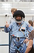 Payload Specialist Scully-Power in full flight suit with helmet (5134456669).jpg