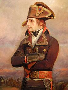 Napoleon Bonaparte, in a dark brown coat, green sash and dark brown pants, looks to the left with a fact of contempt. He has a white and gold hat, and this was painted in the early stages of the campaign.