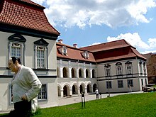 A large, white, two-story building