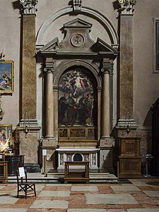 First altar on the right, starting from the entrance