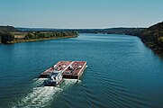 Towboat Ben McCool upbound on Ohio River at Matthew E. Welsh Bridge with two tank barges (6 of 6), near Mauckport, Indiana, USA, 1987