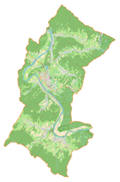 Mapa konturowa gminy Lesko, u góry znajduje się ikonka zamku z wieżą z opisem „Zamek Sobień”