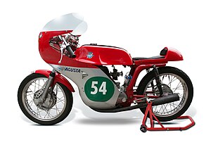 Red Italian motorcycle with racing colors and the number “54” painted on the side