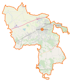 Mapa konturowa powiatu grodziskiego, blisko centrum u góry znajduje się punkt z opisem „Warszawska Kolej Dojazdowa”