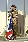 A British soldier of the Royal Artillery, with No. 5 desert combat dress shirt and trousers.