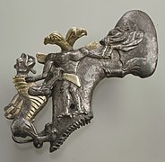 Shaft-hole axe head with bird-headed demon, boar, and dragon MET 1982.5.jpg