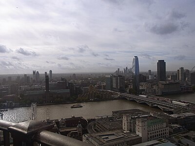 The emerging South Bank cluster as viewed from St Paul's Cathedral, October 2022. The two tallest towers here are One Blackfriars which was completed in 2018 at 163m and the South Bank Tower that was originally constructed in 1972 at 111m but was given an 11-storey height increase in 2017 to bring it up to 150m. There are several more towers planned for this cluster ranging from between 100m and 178.5m tall. There is also an emerging cluster at Elephant and Castle shown on the far left which includes notably, Strata SE1 and another emerging cluster in the distance on the right at Vauxhall/Nine Elms