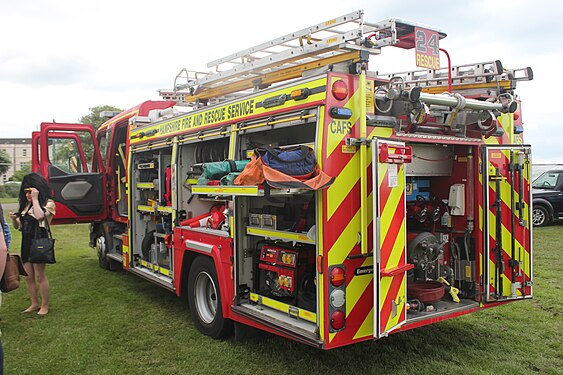 Hampshire Fire and Rescue Service fire appliance with the storage areas open for public viewing.