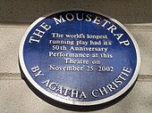 Plaque reading "The Mousetrap - Agatha Christie - The World's longest running play had its 50th Anniversary Performance at this theatre on November 25, 2002