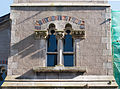 Two-light window in the tower with polychrome brick