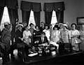 American Association of University Women members with President John F. Kennedy as he signs the Equal Pay Act into law