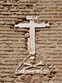 Old cross on the facade