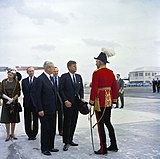 Major-General Sir Julian Gascoigne (right), wearing General officer's full dress as Governor and military Commander-in-Chief of Bermuda (with Minister for Foreign Affairs the Earl of Home, Prime Minister Harold Macmillan, British Ambassador to the United States Sir David Ormsby-Gore, and United States President John F. Kennedy) in 1962.