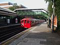 A 1938 London Underground Stock special passing through North Ealing tube station in 2008.