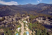 aerial photo of burned trees and homes