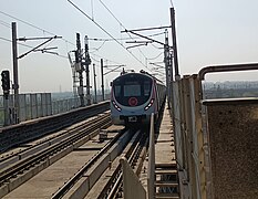 A Hyundai-Rotem train of the Pink Line at Mayur Vihar-I metro station