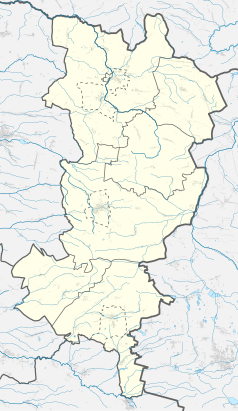 Mapa konturowa powiatu oleskiego, w centrum znajduje się punkt z opisem „Olesno”