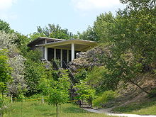 A modern building built between rocks