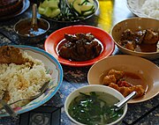 A traditional meal featuring several Burmese curries