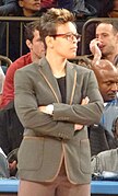 Jeff Walz, coach of the Louisville Cardinals women's basketball team and winner of the 2008 Maggie Dixon Award, standing on the sideline at a UConn vs Louisville game in Veterans Memorial Coliseum