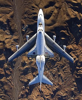 #5: NASA's modified Boeing 747 Shuttle Carrier Aircraft with the Space Shuttle Endeavour STS-126 on top flies over California's Mojave Desert on its way back to the Kennedy Space Center in Florida on Dec 10, 2008. نسب العمل لمُؤَلِّفه: NASA - Photo by Carla Thomas. (public domain)