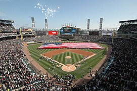 More than 100 U.S. Navy Sailors assigned to Navy Region Midwest, Navy Recruiting Chicago and Naval Station Great Lakes hold an American flag during opening day ceremonies for the Chicago White Soxs major league 080407-N-IK959-197.jpg