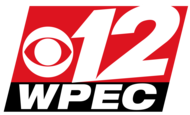 Two slanted boxes, one red and one thinner and black. In the red box, a white CBS eye and a skewed numeral 12. In the black box, the letters W P E C in an extended sans serif in white.