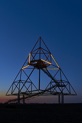 Sculpture "Tetrahedron" (Bottrop, Germany) at night with light installation "Fraktal".