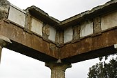 Metopes made from marble slotted into the frieze of the Stoa at Brauron