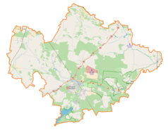 Mapa konturowa powiatu tomaszowskiego, po lewej nieco u góry znajduje się punkt z opisem „Rokiciny”